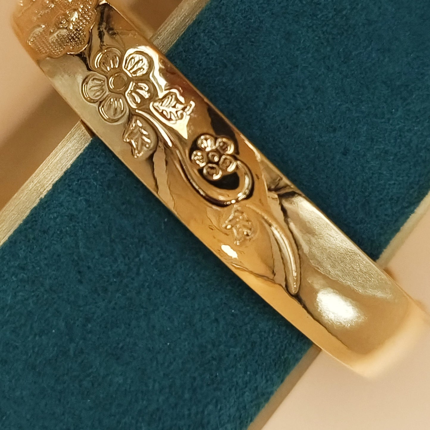 Gold plated floral detail cuff bangle