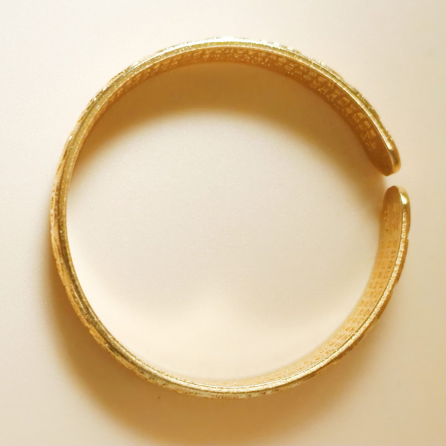 Gold plated calligraphy pattern detail cuff bangle