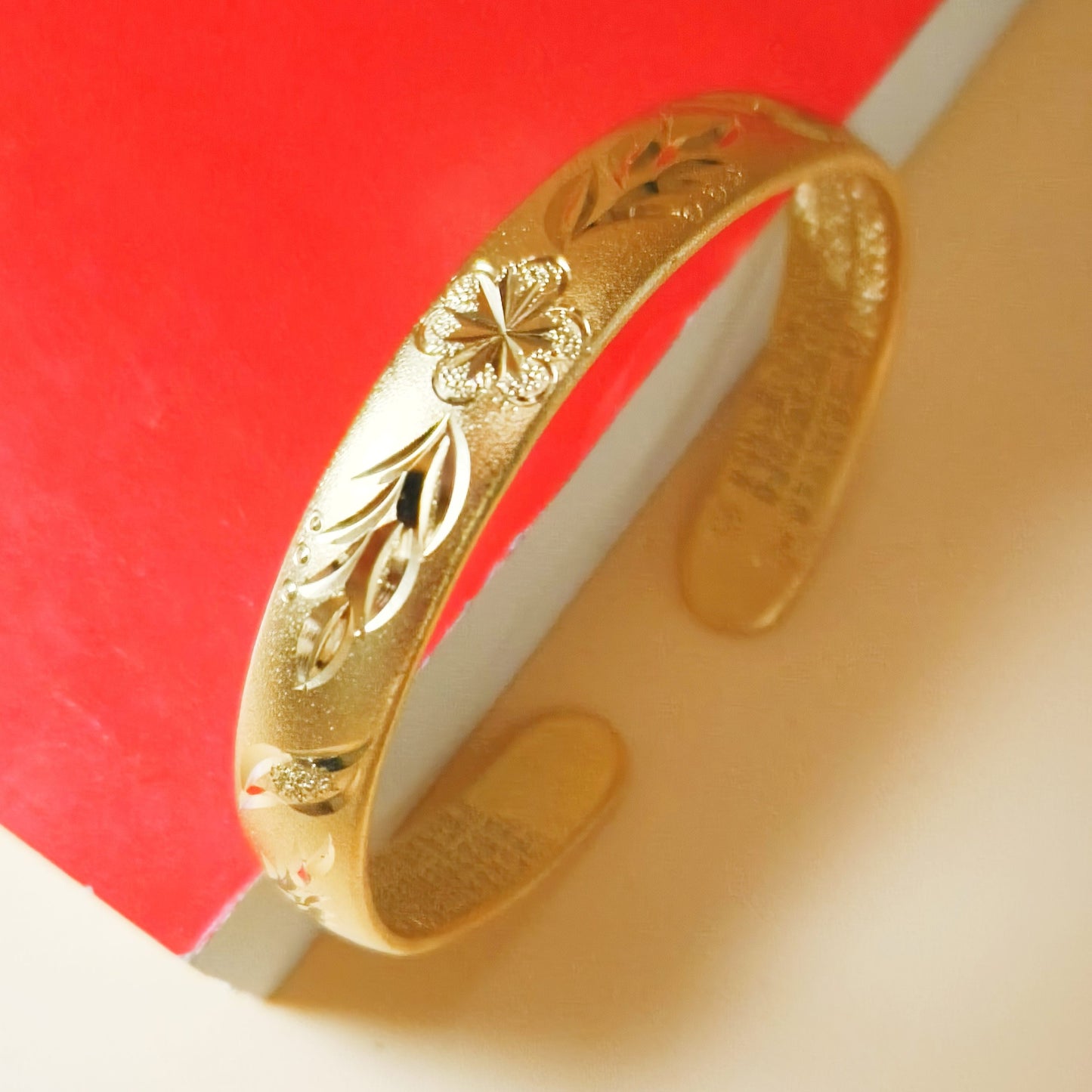 Gold plated floral detail cuff bangle