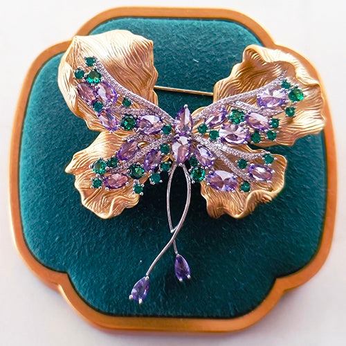Gold and purple butterfly brooch