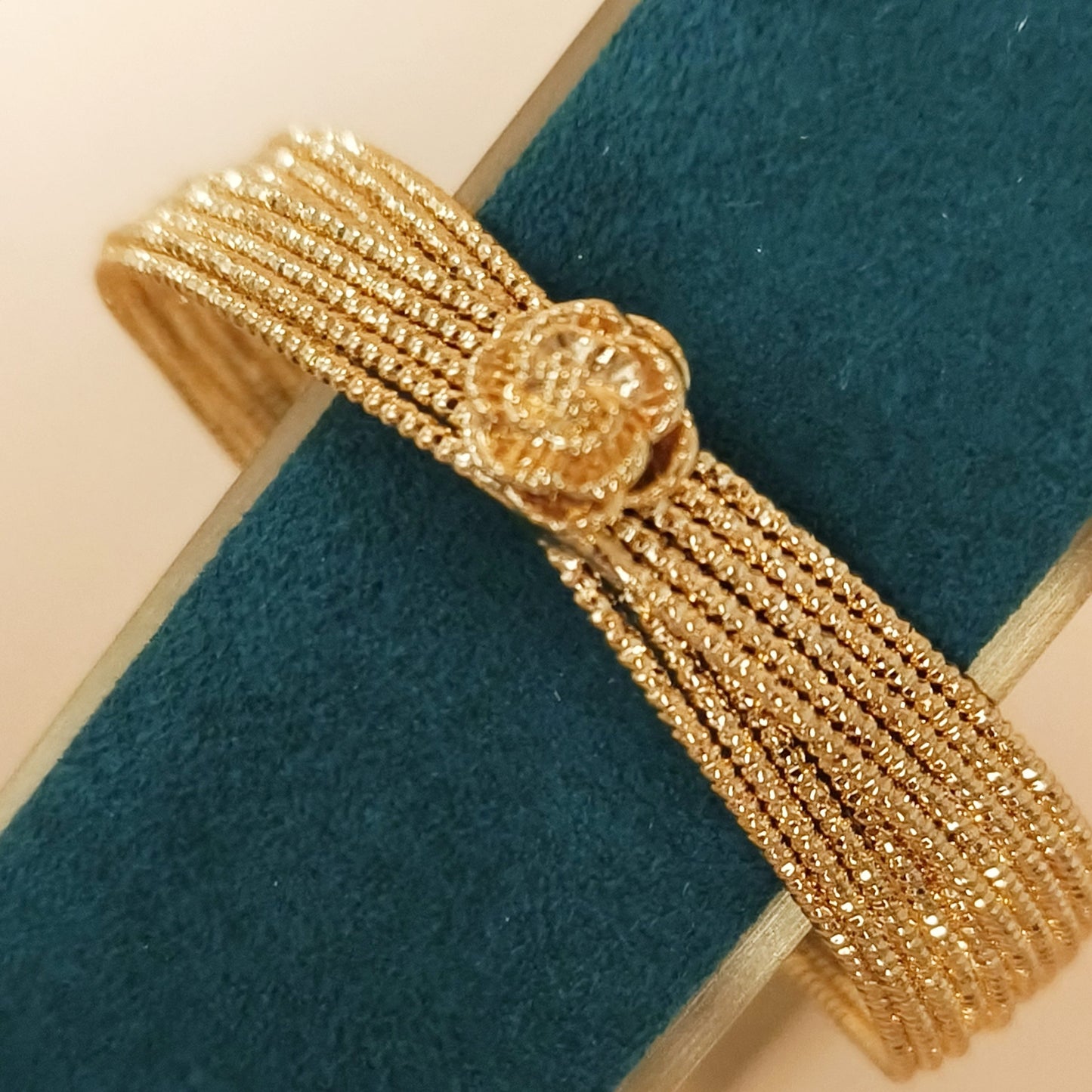 Gold plated flower knot cuff bangle