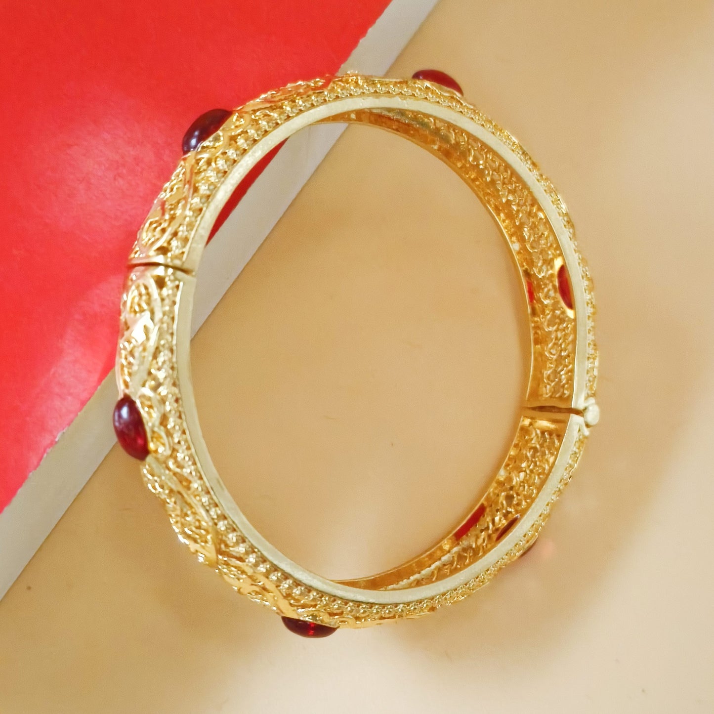 Lattice detail Gold plated Bangle with red stone