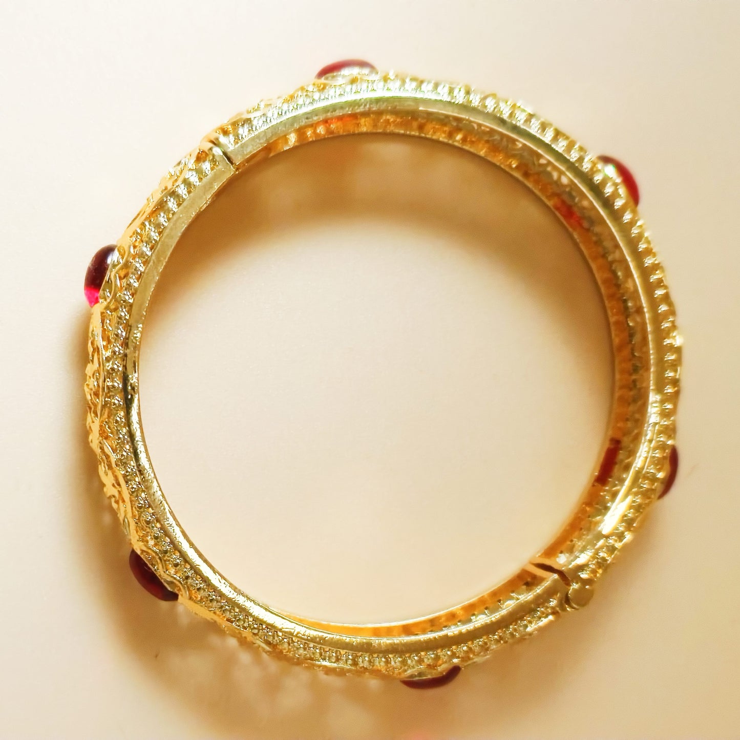 Lattice detail Gold plated Bangle with red stone