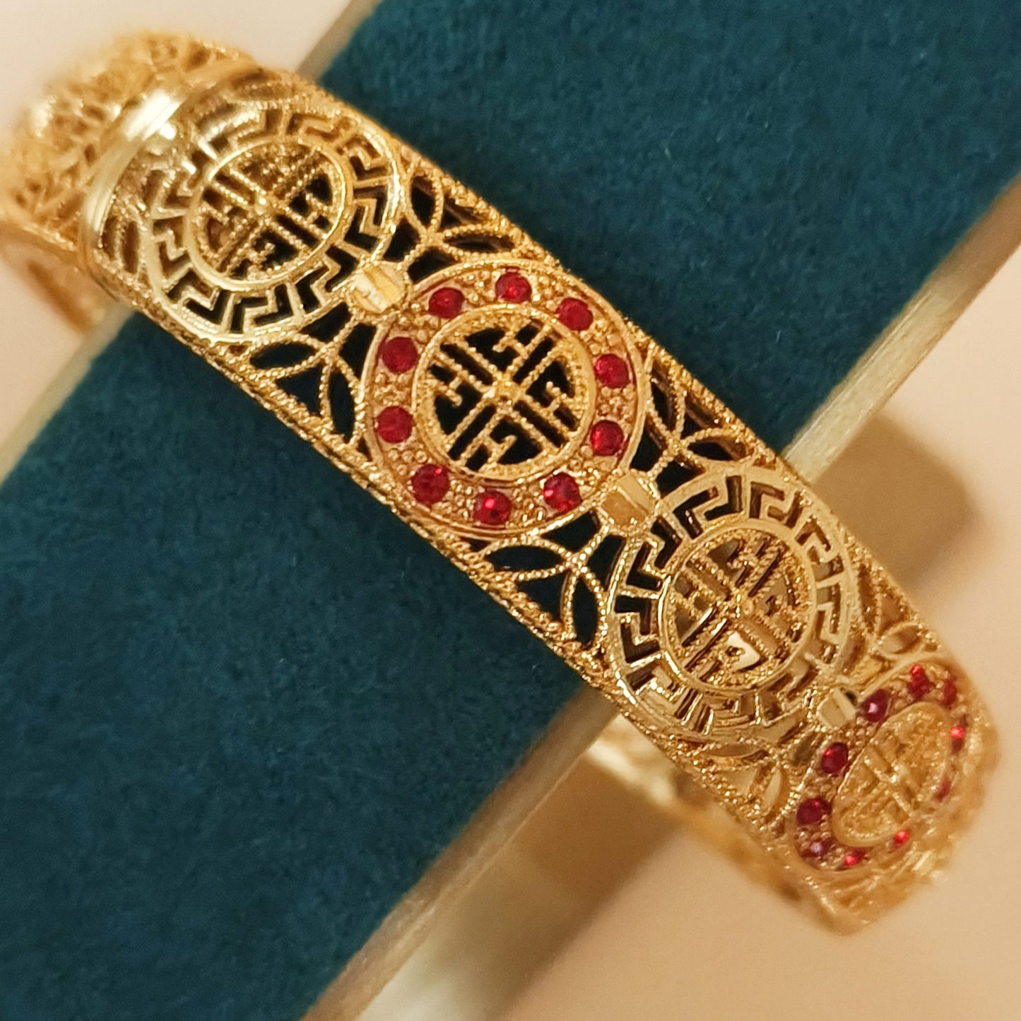Gold plated lattice detail bangle with stones