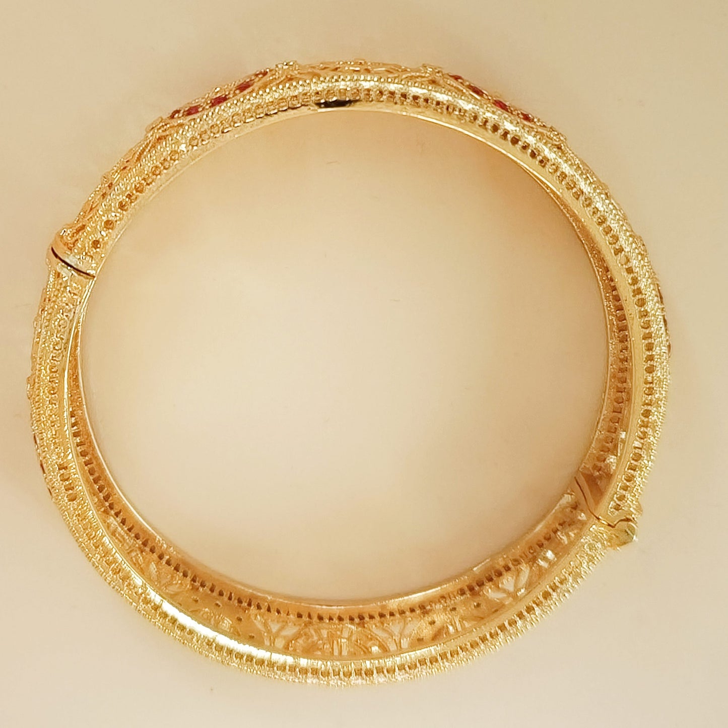 Gold plated lattice detail bangle with stones