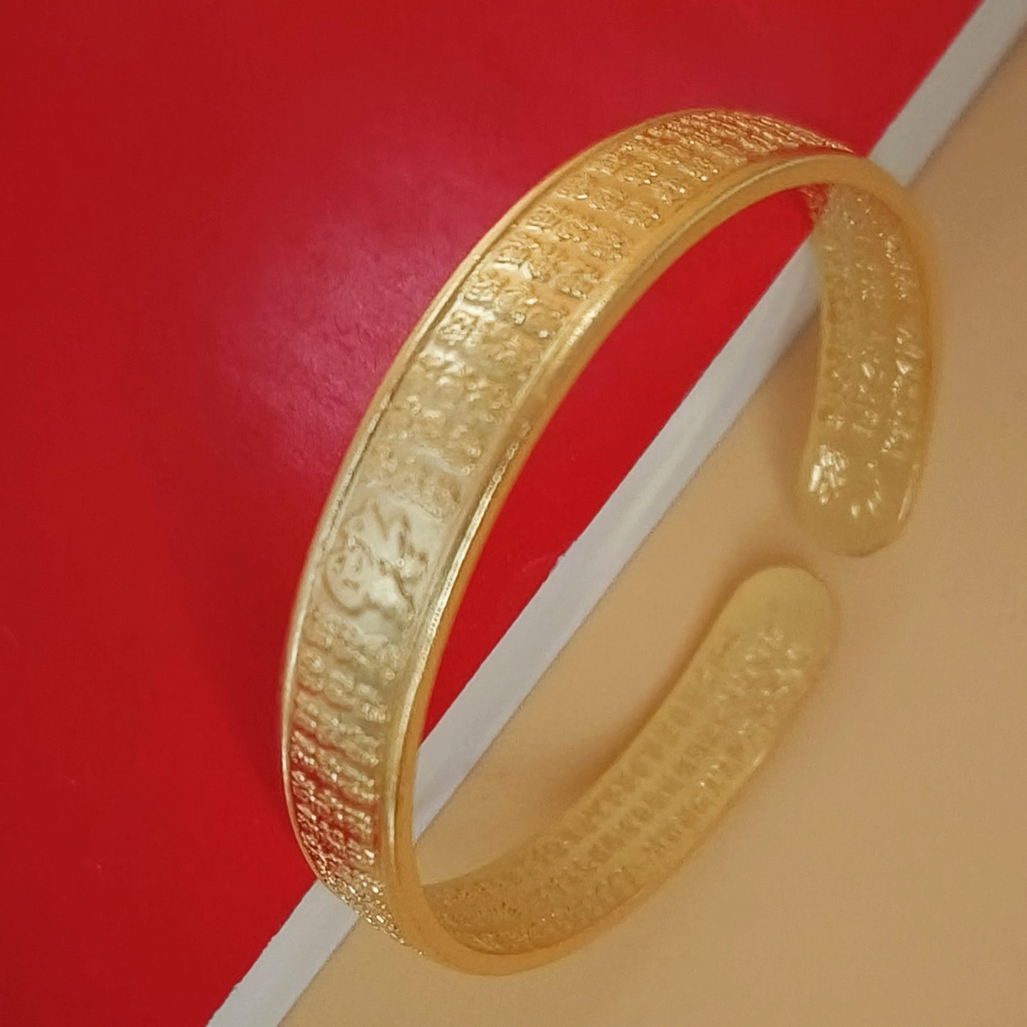 Gold plated calligraphy pattern detail cuff bangle