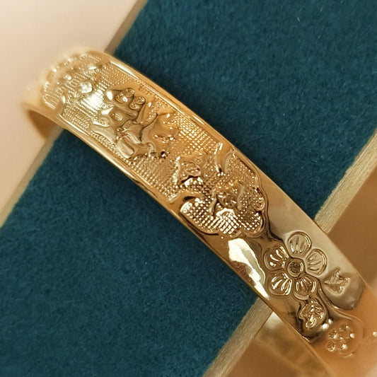 Gold plated floral detail cuff bangle