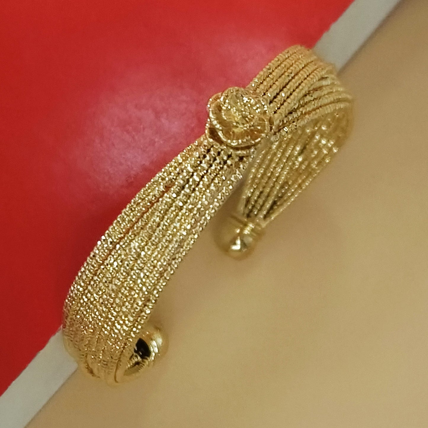 Gold plated flower knot cuff bangle