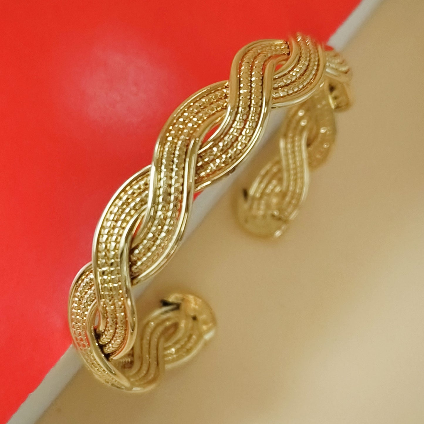 Gold plated braided twist cuff bangle