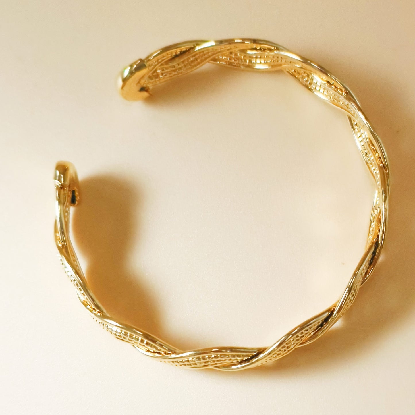 Gold plated braided twist cuff bangle
