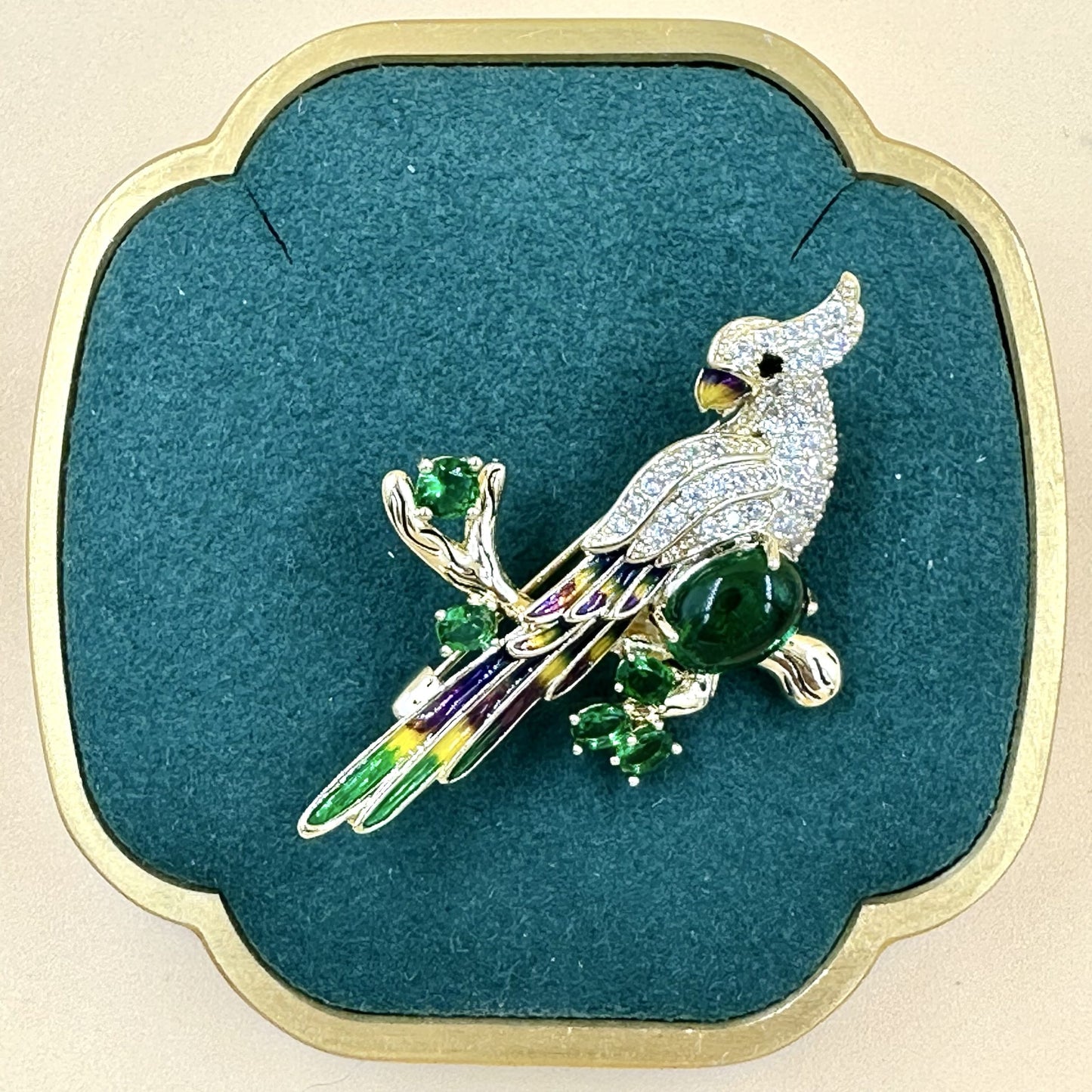 Gold Parrot Brooch with green stone