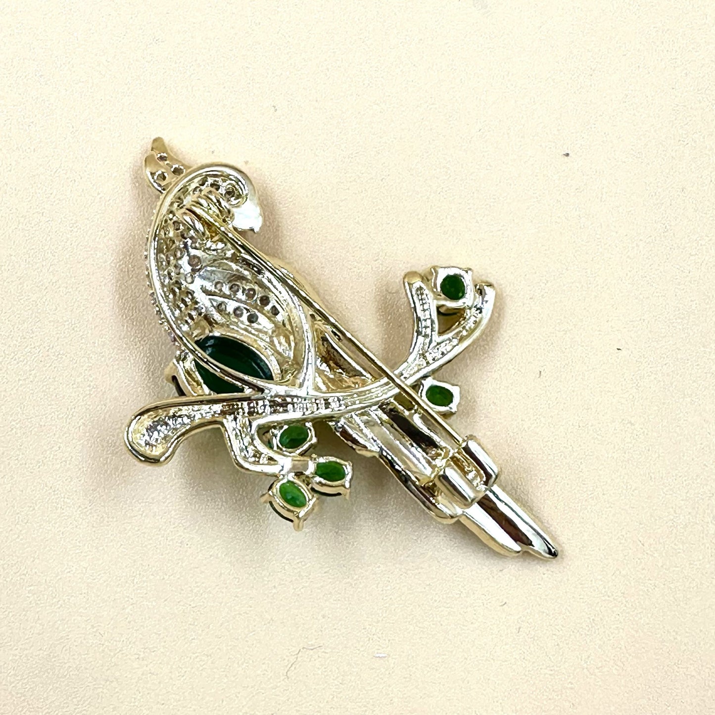 Gold Parrot Brooch with green stone