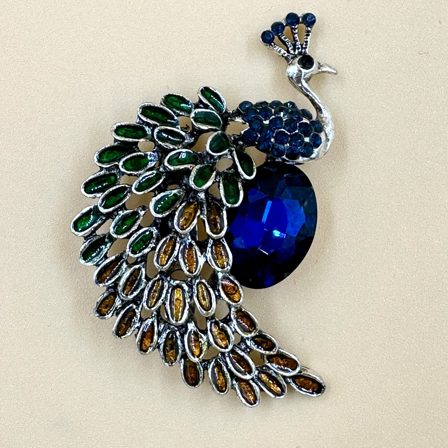 Peacock brooch
