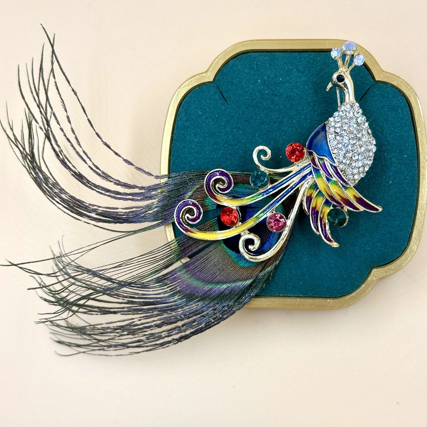 Peacock feather brooch